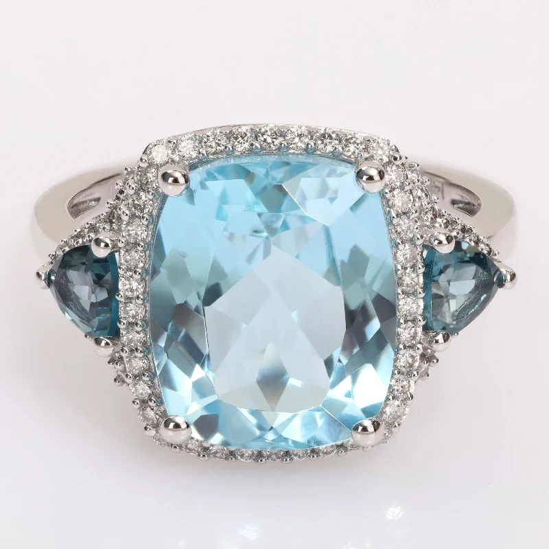 Miadora London & Sky Blue Topaz and 1/3ct TDW Diamond 3-Stone Halo Cocktail Ring in 14k White Gold